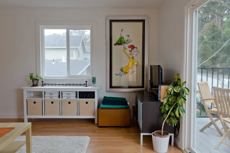 A cozy, light-filled living room with a balcony